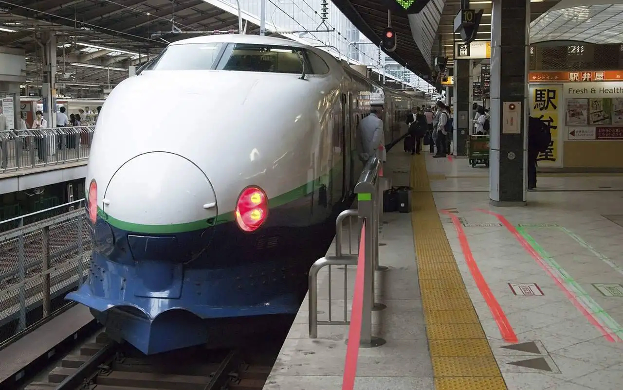 Tokyo, Japan - May 20, 2012: Shinkansen bullet train at Tokyo railway station. Shinkansen is world's busiest high-speed railway operated by four Japan Railways companies.